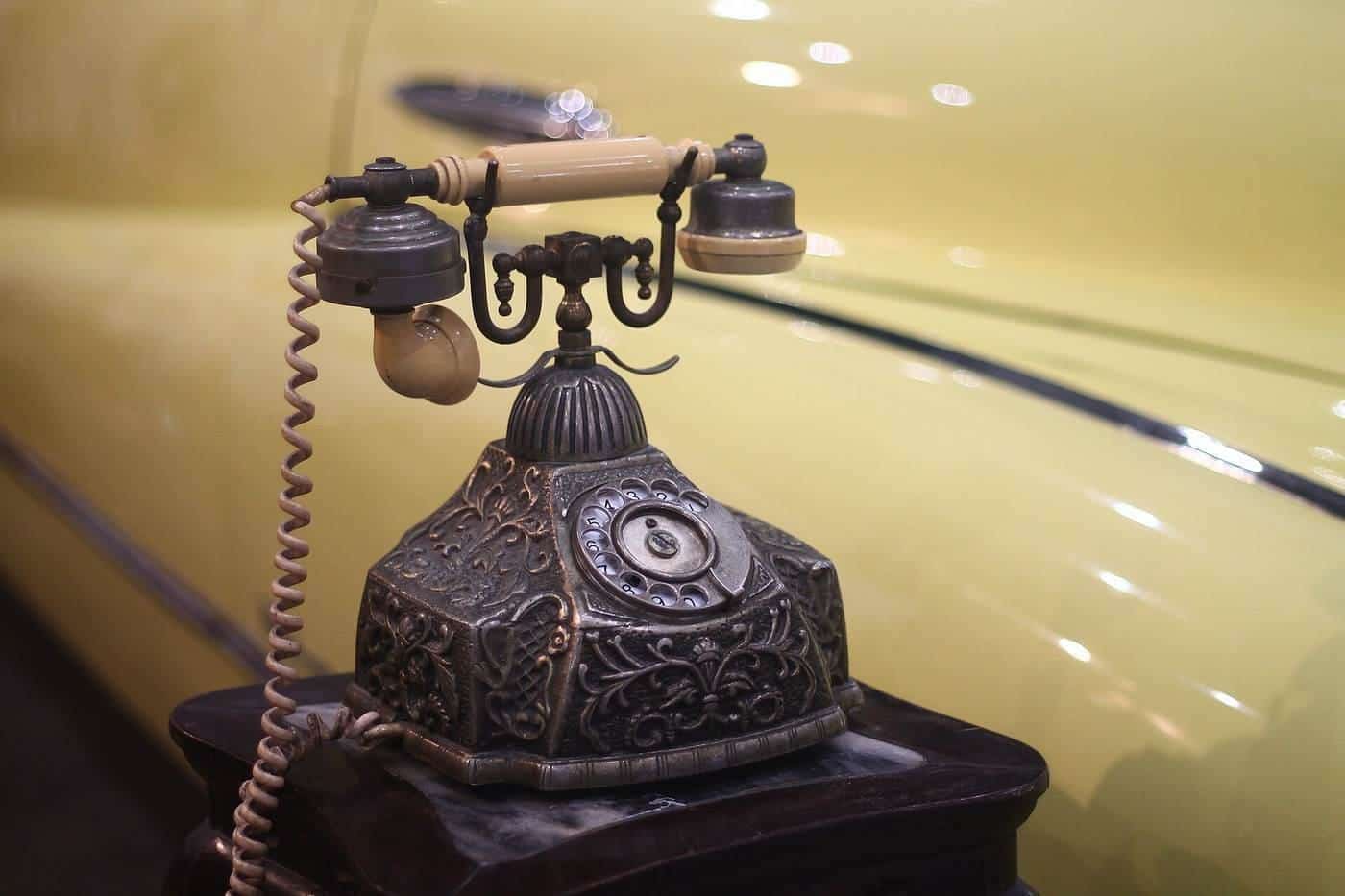 Ornate antique rotary telephone on a table